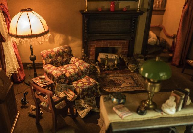 A photograph of a nutshell study of unexplained death showing a detail of a a living room.