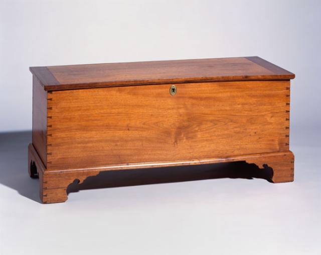 A walnut, yellow pine, and poplar Neat and Plain style chest.
