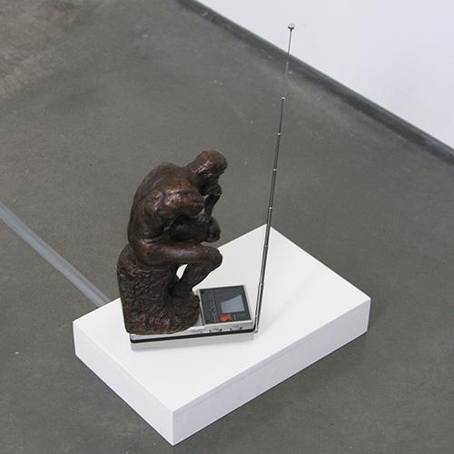 Name June Paik's Whitney Buddha Complex sculpture made from bronze.
