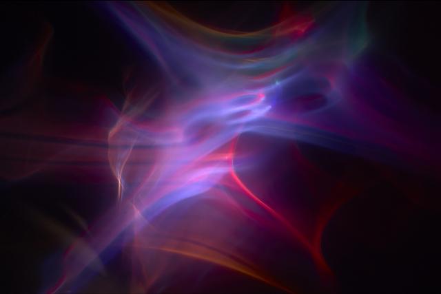 A study of light with pink, purple, blue and red tones.