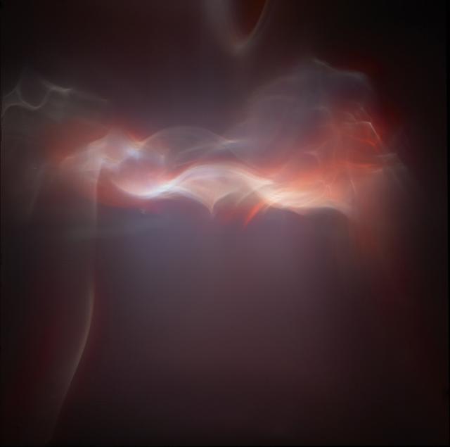 A study of light with red, creme, pink and maroon tones. 