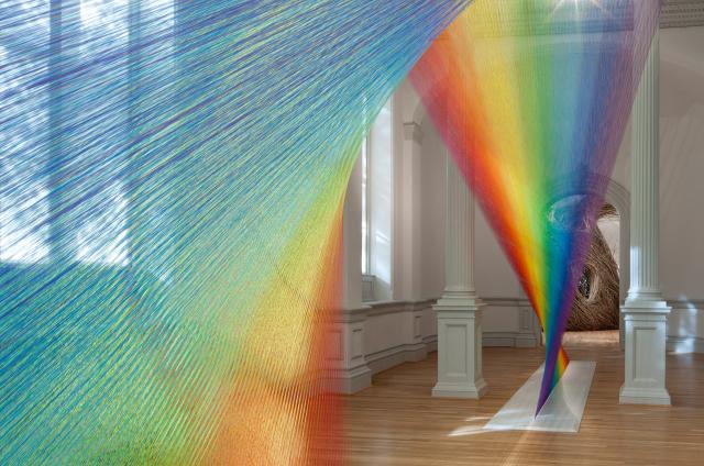 Dawe's Plexus A1 displaying an array of colors with Dougherty's Shindig made of bend twigs in the background