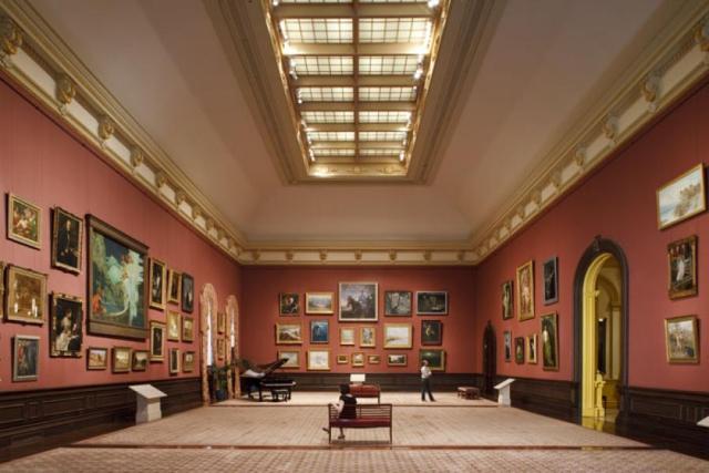Grand salon hung with paintings