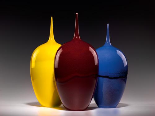 An image of three of Lee's porcelain objects all similar in shape, but differ in glaze.
