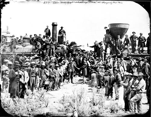 Russell's ambrotype of rail workers lined up on two sides and two shaking hands in the middle.