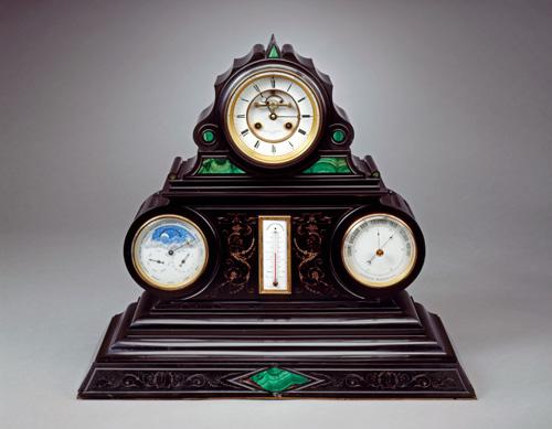 An image of a marble and malachite mantel clock.