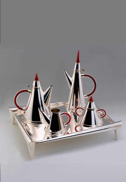 A photo of Vitali's 25th anniversary tea and coffee set made from glass and silver.