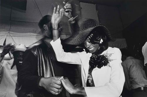 A gelatin silver print of a couple dancing.