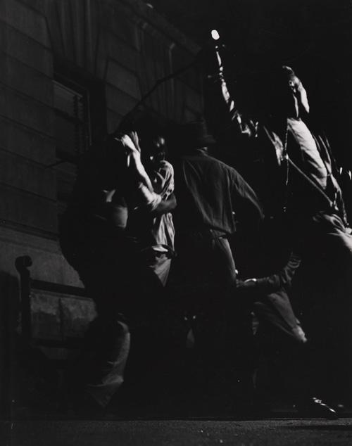 Parks' gelatin silver print of a night shot with figures.