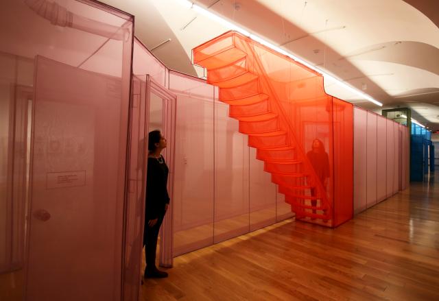 Pink Hub sculpture with orange stairs