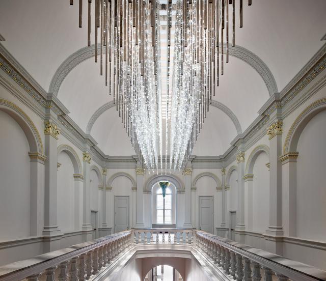 an image of the staircase with a grand LED chandelier at the Renwick Gallery.