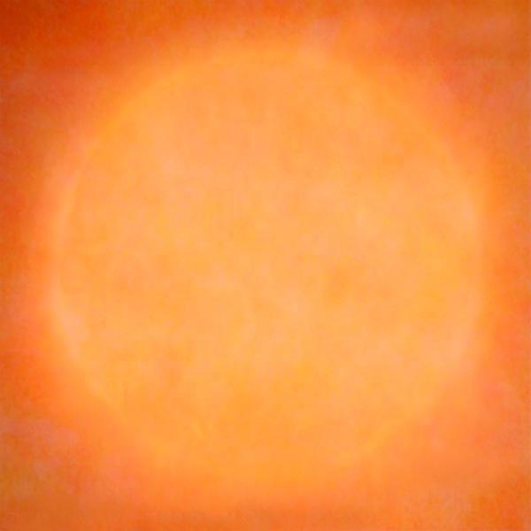A photograph of the sun in an orange hue.