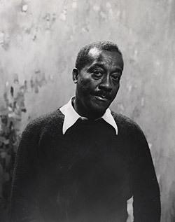 A black and white photograph of a man.