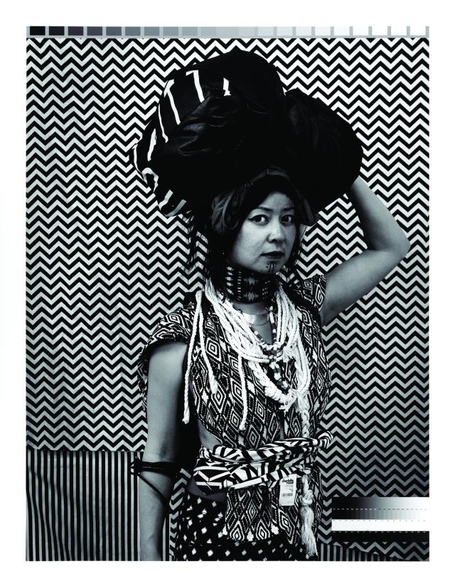 An image of a woman with a big hat.