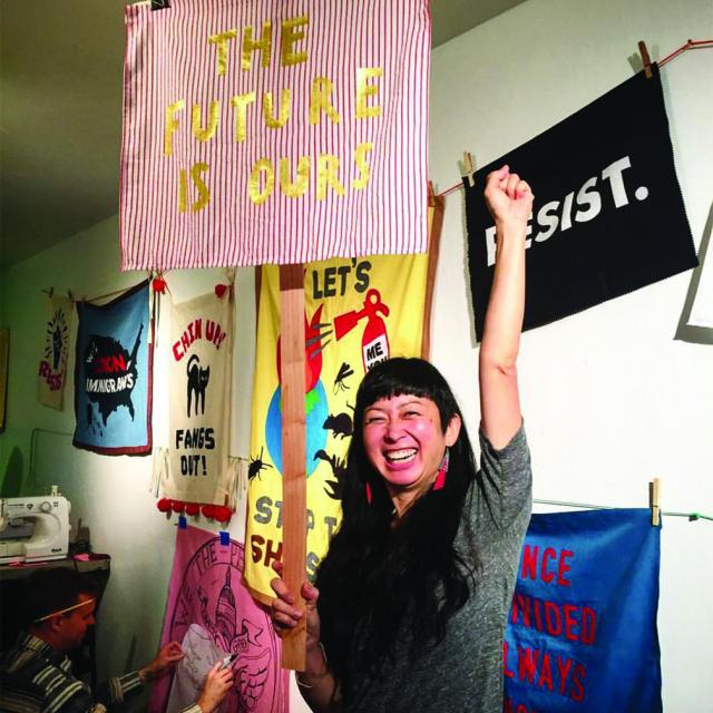 This is a picture of artist Syjuco in her studio.