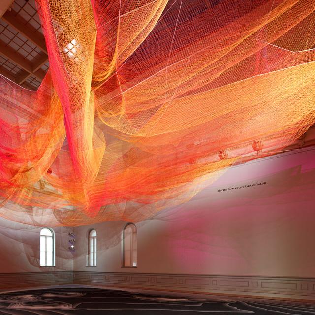 A gallery shot inside the grand salon with Janet Echelman's hanging sculpture.