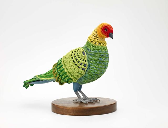 A crocheted Carolina Parakeet. 