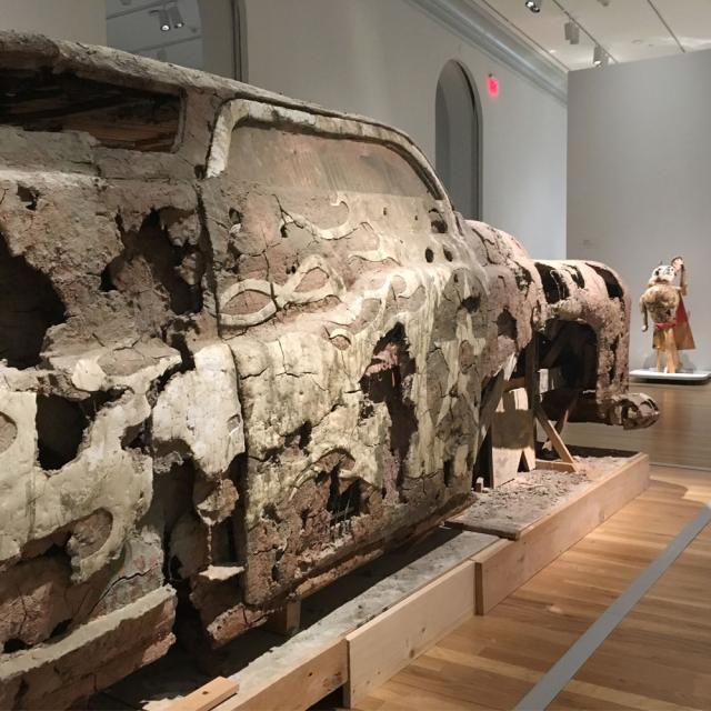 A detail shot of an unfired clay car. 