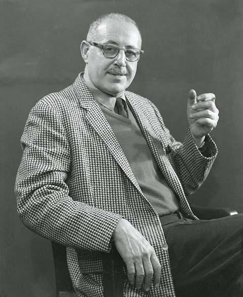 A picture of a man sitting in a chair.