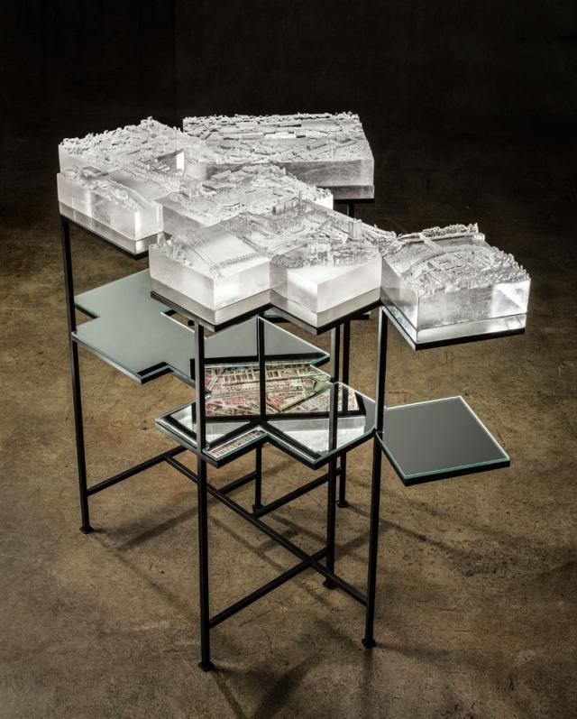 A photograph of an installation with mirrored glass and prototyped pattern kilncast glass.