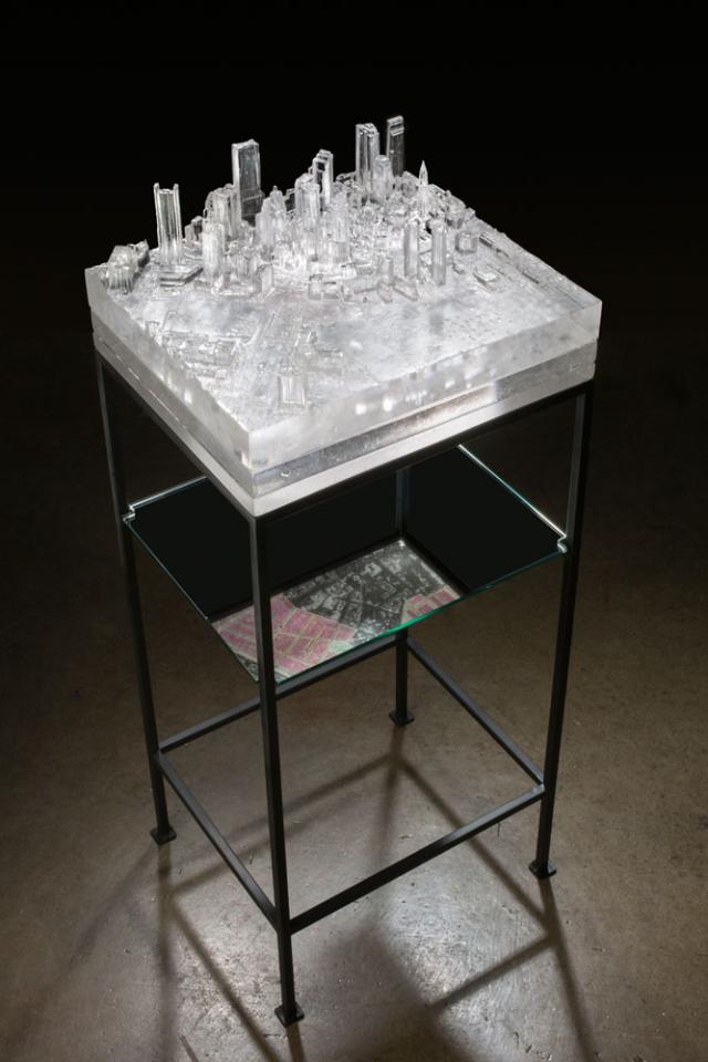 An in gallery photograph of a rapid prototyped pattern kilcast glass with a mirror under it.