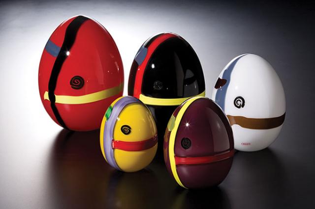 Five glass eggs of differing colors.
