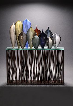 Multiple glass vessels on a rectangular structure.