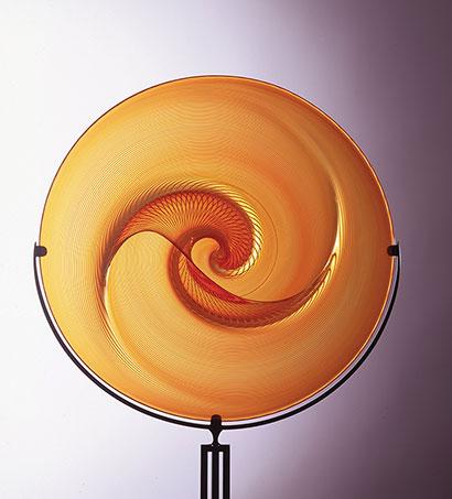 An orange glass circular object.