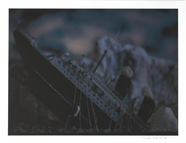 An image of a ship sinking.