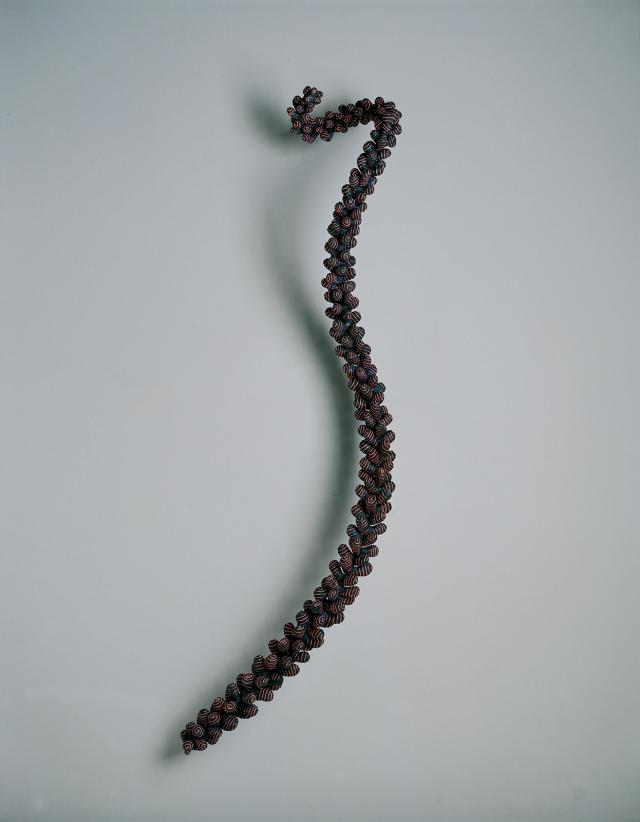 An artwork made to look like a piece of plant that's long and skinny.