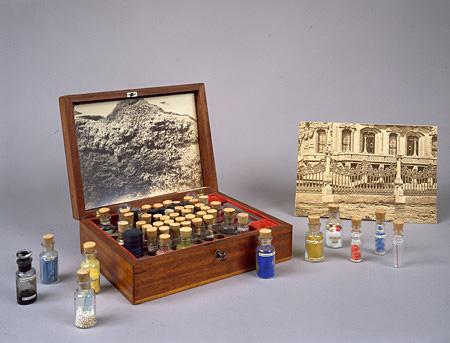A box with small glass jars inside.