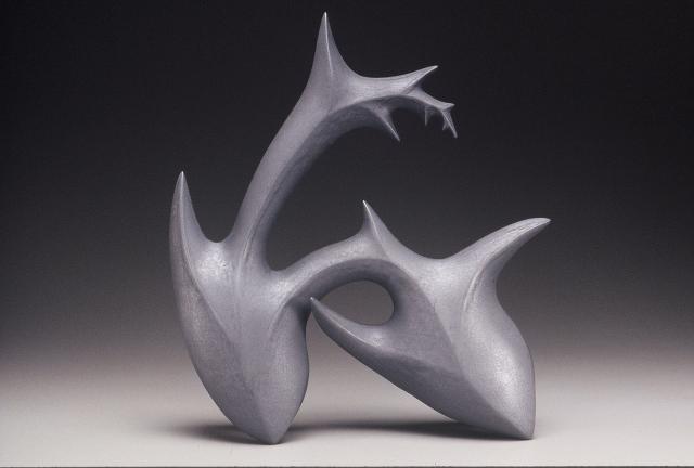 A black metallic abstract ceramic structure.