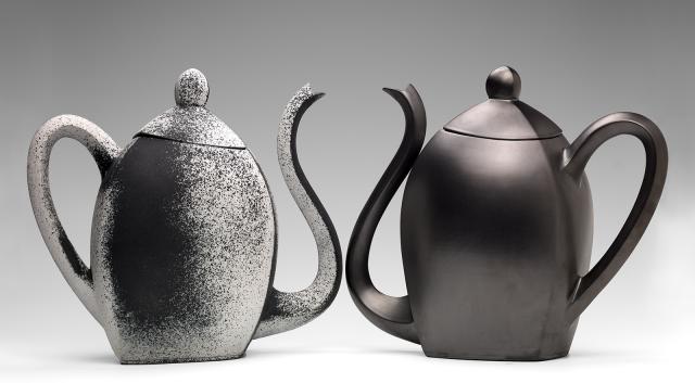 Two ceramic teapots in black.