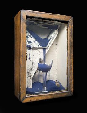 A box with a blue glass inside.