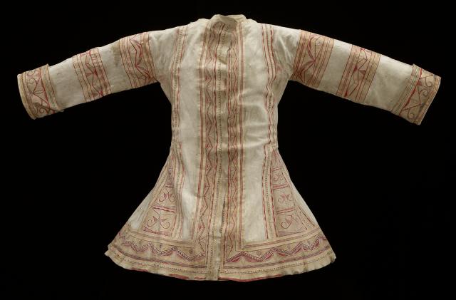 A white coat with red details.