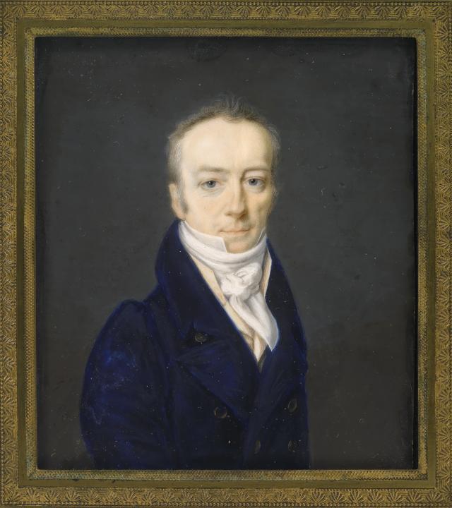 A portrait of a man sitting. 