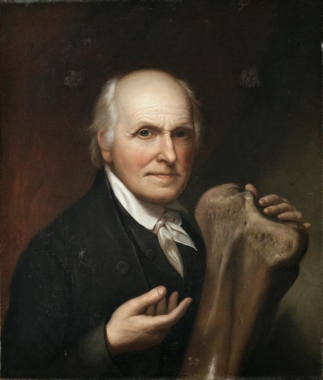 A portrait of a man sitting. 