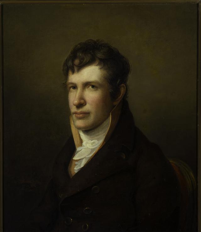 A portrait of a man sitting. 