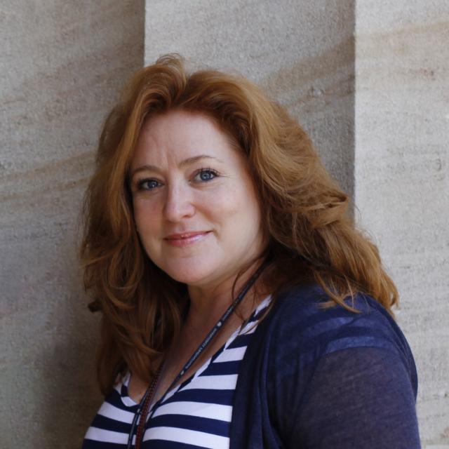 A headshot of a woman
