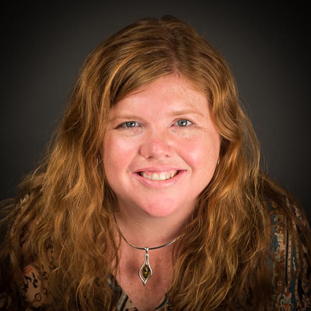 A headshot of a woman