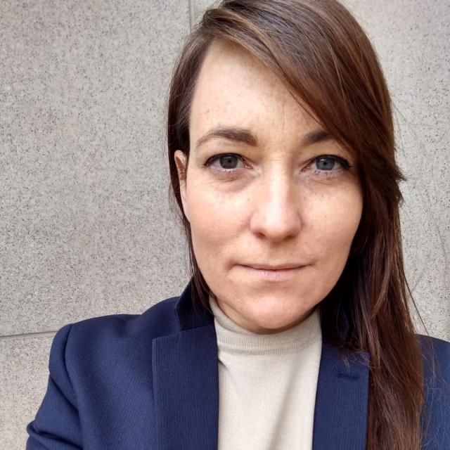 A headshot of a woman