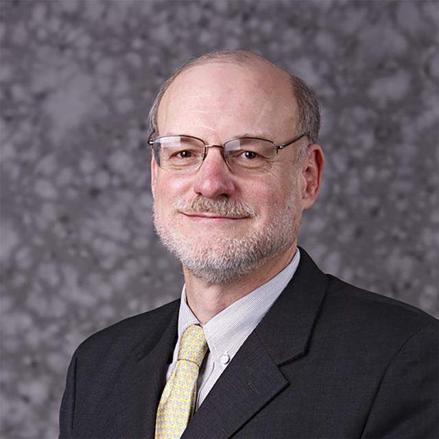 A headshot of a man