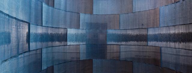 A photograph of indigo cloth artwork