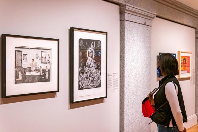 A photograph of a person inside an art museum. 