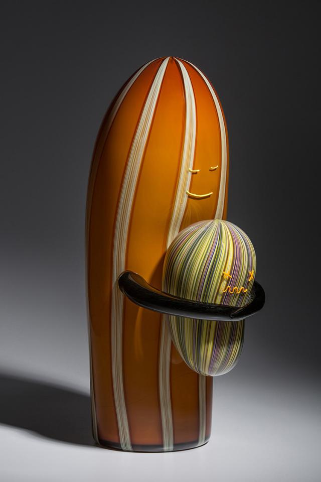 A photograph of an object hugging another object. 