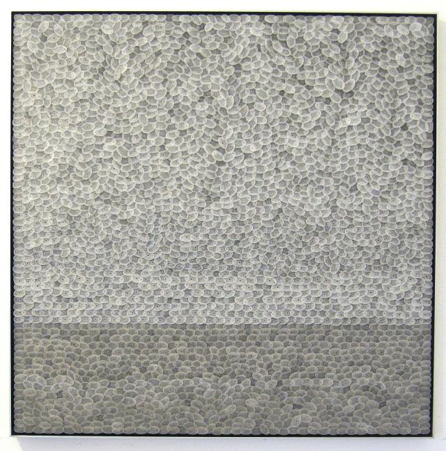 An artwork with many small circles. 