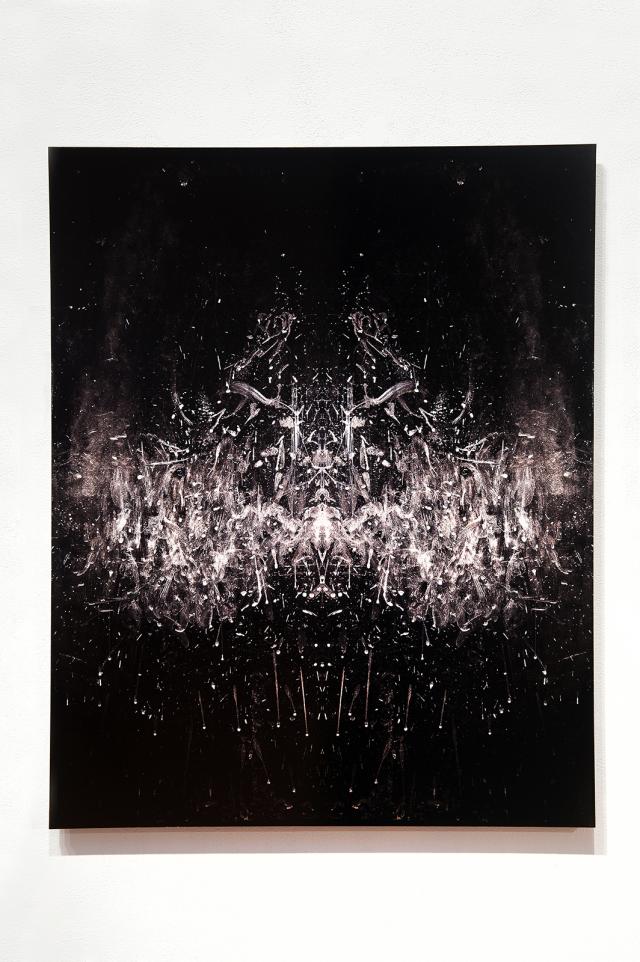 An artwork with a black background and grey tones on top. 