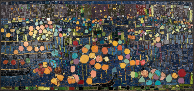 Colorful glass and ceramic mosaic tiles in plaster.