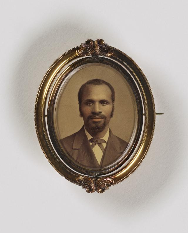 A portrait of a man with goatee contained in a brooch