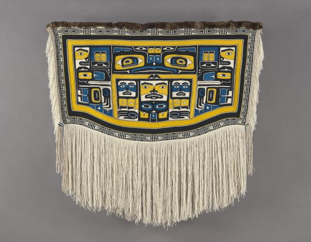 A woven blanket with a Native American design